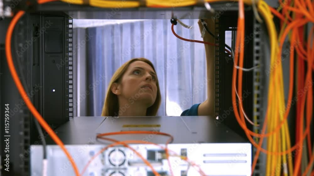 Poster Technician looking at open server locker