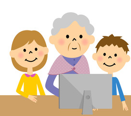 孫とパソコンに向かう高齢者