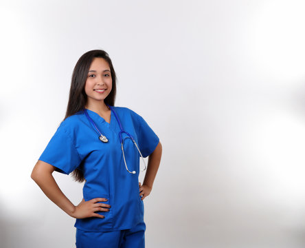 Friendly Nurse In Blue Scrubs