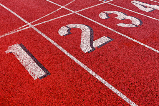 Track and field starting lane numbers 1-4.