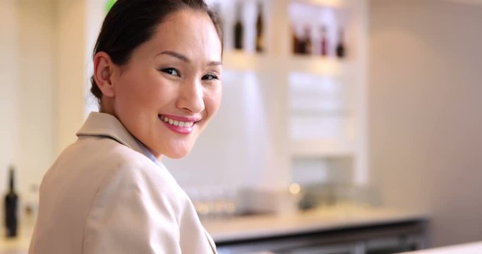 Asian businesswoman smiling at camera