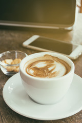 Cup of Coffee on Wooden Table. Selective Focus. Vintage retro fi