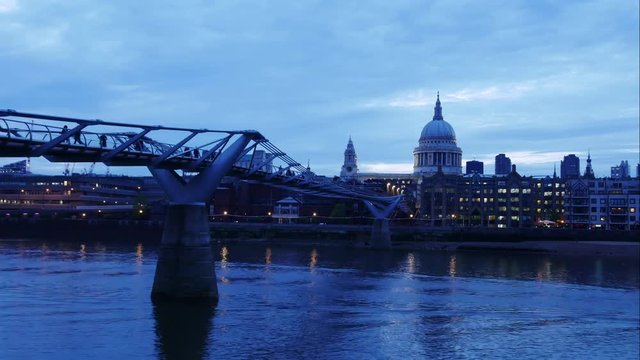 Timelapse of Millennium Bridge leading to Saint Paul's Cathedral during sunset in central London, UK

