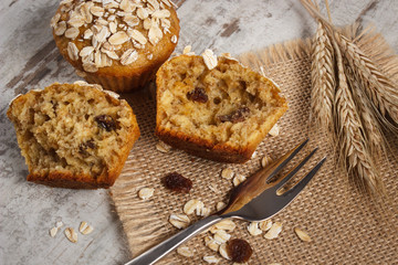Fresh muffins with oatmeal baked with wholemeal flour and ears of rye grain, delicious healthy dessert