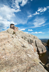 Harney Peak Fire Lookout Tower and pump house with small dam in Custer State Park in the Black Hills of South Dakota USA