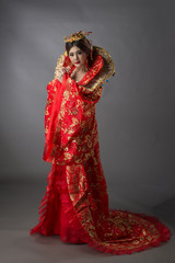 Obraz na płótnie Canvas Beautiful Asian model Young asia Oriental woman wearing chinese