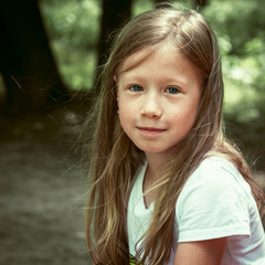 Portrait of beautiful little girl summer outdoors
