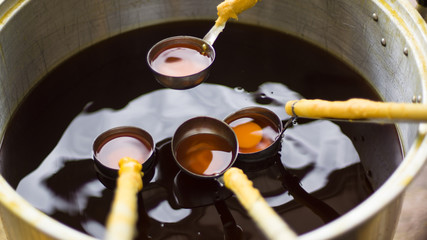 Melting candle to the traditions of Buddhist Lent.