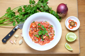 Fixings for homemade Pico de Gallo Mexican tomato salsa, viewed from above.