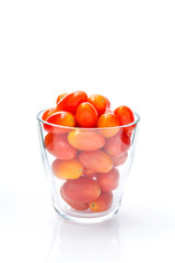 red ripe berry tomato in glass white background