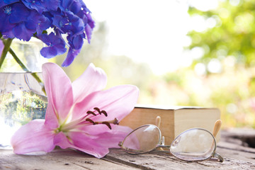 book on the old table with flowers