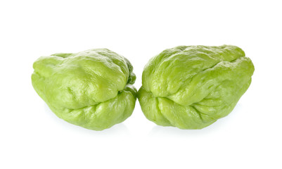 uncooked whole fresh chayote on white background