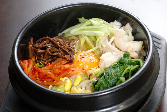 Rice with vegetable in hot bowl Korean food