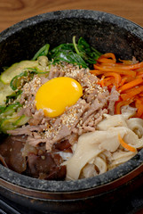 Rice with vegetable in hot bowl Korean food