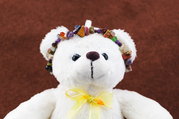 Selective focus a teddy bear toy with stone Artificial chain