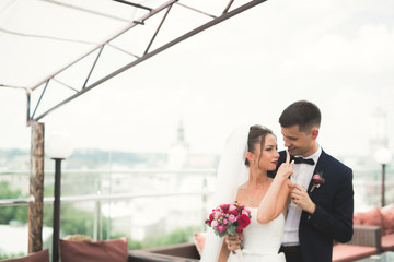 Luxury married wedding couple, bride and groom posing in old city