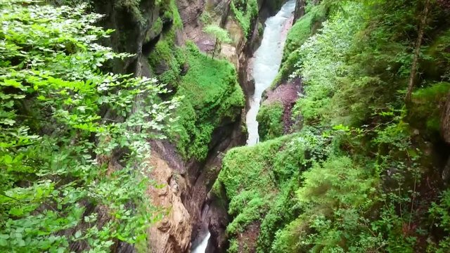 Aerial view and camera flight over rapids in Partnach Gorge or Partnachklamm is a scenic location and nature attraction in Germany near Garmisch Paterkirchen. 