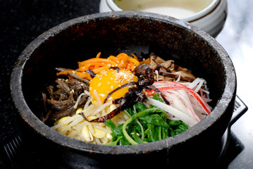 Rice with vegetable in hot bowl Korean food