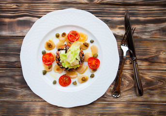 Smoked salmon salad with potato rosti and creme fraiche. Overhea