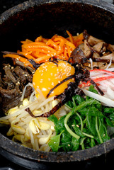 Rice with vegetable in hot bowl Korean food
