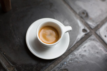 an espresso on tiles