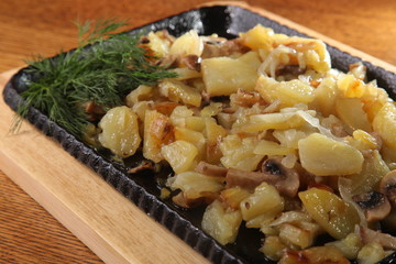 fried potatoes on a hot frying pan