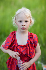 girl holding a bottle of water