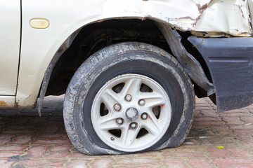 close up shot of flat tire waiting for repair