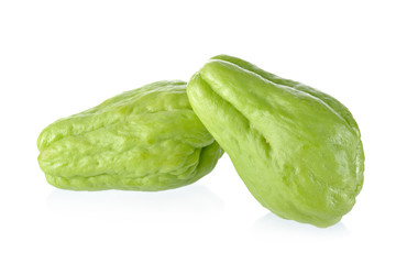 uncooked whole fresh chayote on white background