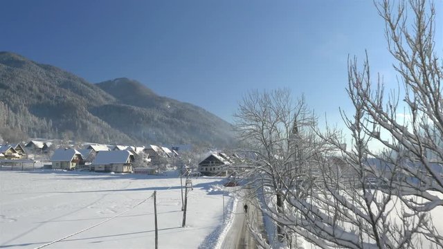 AERIAL: Sunny mountain town in winter