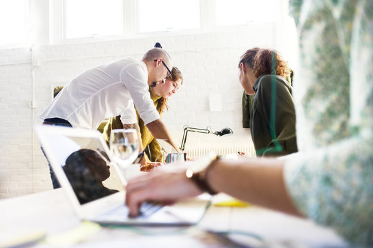 Business people discussing over project in creative office
