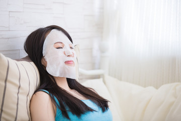 woman with cloth facial mask