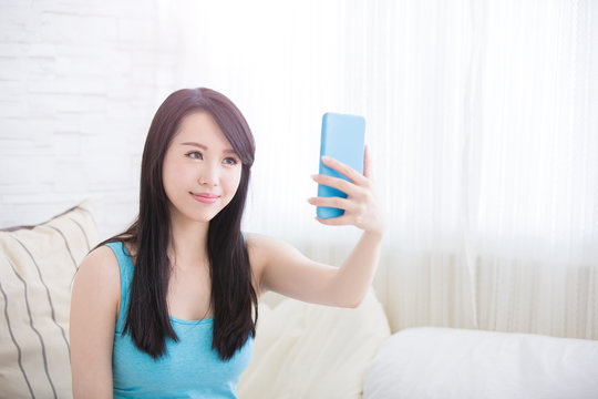 young woman is taking selfies