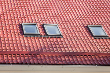 Red Metal tiled Roof with New Dormers, Roof Windows, Skylights and Roof Protection from Snow Board