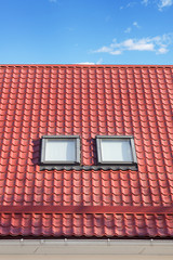 Red Metal tiled Roof with New Dormers, Roof Windows, Skylights and Roof Protection from Snow Board
