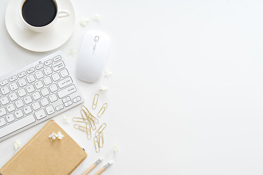 Office Desk Table With Computer, Supplies And Coffee Cup