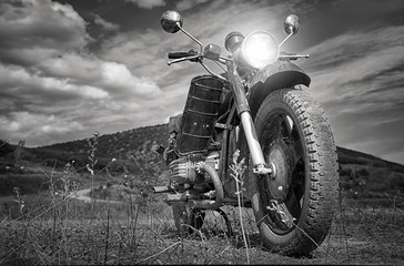 Freedom.Motorbike under sky.Vintage photo effect added for create atmosphere © Glebstock