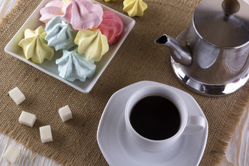 Meringue Cookies and cup of coffee.