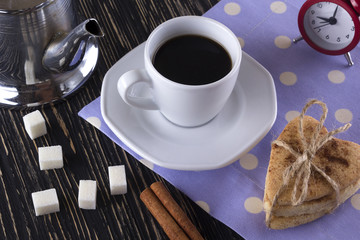 Cup of coffee with cinnamon cookies.