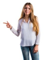 Teen girl pointing to the lateral