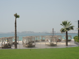 Dubai Jumeirah Beach with the Palm Jumeirah on Arabian Gulf.
