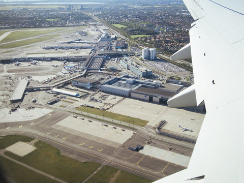 Cropped image of airplane over airport