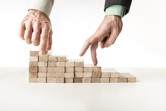 Fingers walking up steps of blocks