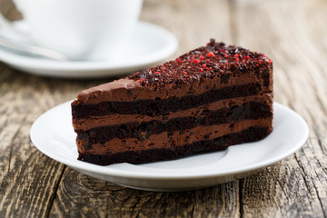 Tasty vegetarian chocolate dessert on wooden table for celebrati