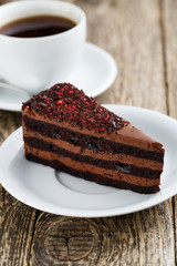 Tasty vegetarian chocolate dessert on wooden table for celebrati