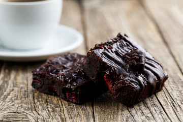 Tasty vegetarian brownie slice on wooden table for celebration.