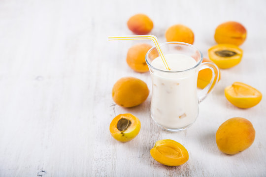 Apricot smoothie on a wooden table