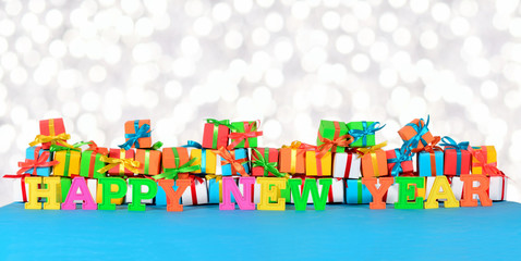 Happy New Year colorful text on the background of varicolored gi