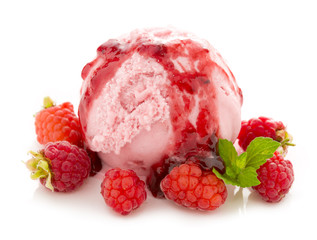 Ice cream and fresh red raspberries.