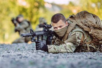 Fototapeta premium Special forces soldiers with weapon take part in military maneuv